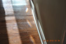 Delaminating engineered laminate due to mopping.